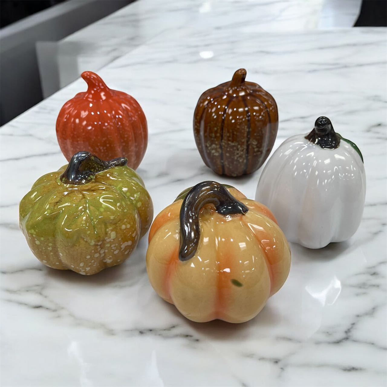 A set of five ceramic Pumpkins